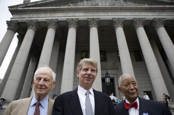 FILE - In this June 25, 2009 file photo, then Manhattan District Attorney Robert Morgenthau, left, endorses Cyrus Vance Jr., center, his former deputy, in the race to replace him while standing in front of the New York County Supreme Courthouse. Vance, the veteran New York City prosecutor overseeing a criminal investigation into former President Donald Trump, said Friday, March 12, 2021, that he will not seek re-election. With them, at right, is former New York Mayor David Dinkins. (AP Photo/Yanina Manolova, File)