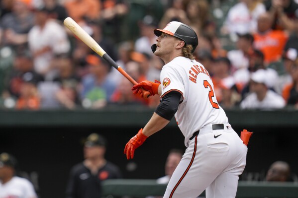 Baltimore Orioles' Gunnar Henderson watches his home run against the Seattle Mariners during the first inning of a baseball game at Oriole Park at Camden Yards, Sunday, May 19, 2024, in Baltimore. (AP Photo/Jess Rapfogel)