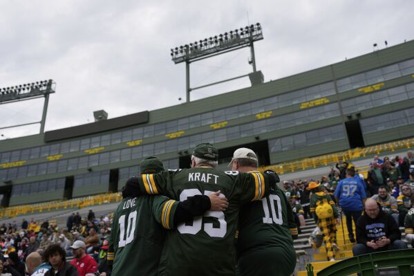 Green Bay Packers fans embrace at Lambeau Field before the first round of the NFL football draft, Thursday, April 24, 2025, in Green Bay, Wis. (AP Photo/John Locher)