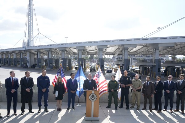 Acting commissioner of Customs and Border Protection Troy Miller, center, speaks during a news conference at the San Ysidro Port of Entry, Thursday, Oct. 26, 2023, in San Diego. The U.S. Customs and Border Protection has announced a new government-wide strategy that will target not only fentanyl but precursor materials used to make the synthetic opioid.(AP Photo/Gregory Bull)