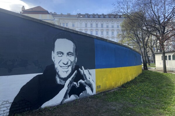 A picture of Alexei Navalny on a mural in Vienna, Austria, Wednesday, March 27, 2024. Two large portraits of the late Russian opposition leader Alexei Navalny have been spray-painted on a property owned by the family of a former Czech foreign minister behind a monument to Soviet soldiers in Vienna. (AP Photo/Philipp-Moritz Jenne)