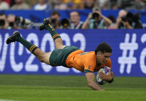 Australia's Ben Donaldson scores a try during the Rugby World Cup Pool C match between Australia and Georgia at the Stade de France in Saint-Denis, north of Paris, Saturday, Sept. 9, 2023. (AP Photo/Thibault Camus)