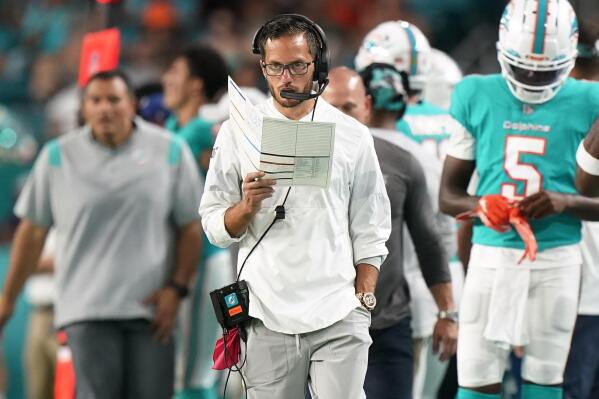 Miami Dolphins head coach Mike McDaniel walks the sidelines during the first half of a NFL preseason football game against the Las Vegas Raiders, Saturday, Aug. 20, 2022, in Miami Gardens, Fla. (AP Photo/Wilfredo Lee)