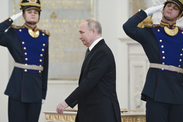 FILE - Russian President Vladimir Putin arrives at a ceremony to present medals on the eve of Heroes of the Fatherland Day at St. George Hall of the Grand Kremlin Palace, in Moscow, Russia, Friday, Dec. 8, 2023. Putin seems to be hoping that relentless military pressure, changing Western political dynamics and a global focus on the war in Gaza will drain support for Ukraine. (Sergei Guneyev, Sputnik, Kremlin Pool Photo via AP, File)