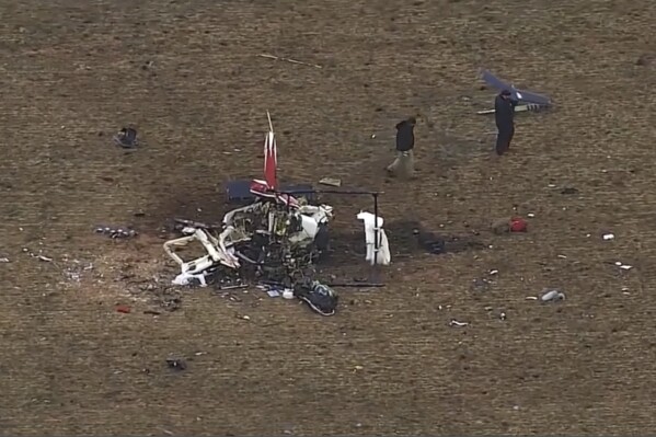 This image from video provided by KOCO shows the scene of a helicopter crash in western Oklahoma on Jan. 20, 2024. A dead goose was found in part of the flight control system of a medical helicopter that crashed in western Oklahoma, killing all three people on board, according to a preliminary report by the National Transportation Safety Board, Saturday, Feb. 3.(KOCO-5 via AP)