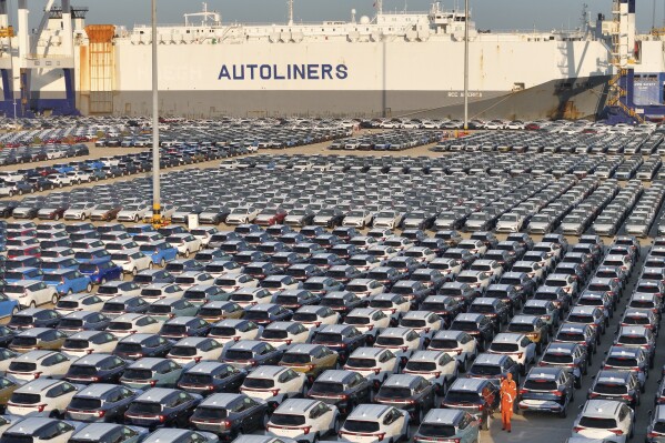 FILE - This aerial view shows new cars waiting to be exported at a dockyard in Yantai in eastern China's Shandong province on Nov. 2, 2023. China’s exports rose in November, the first increase since April, while imports fell, according to customs data released Thursday, Dec. 7, 2023. (Chinatopix via AP, File)