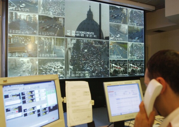 Live signals from the Vatican, St. Peter's Basilica, and the surrounding streets are seen in the control room at the municipal police headquarters in Rome, Wednesday, April 6, 2005. The Vatican crosses a key milestone Thursday, May 9, 2024, in the run-up to its 2025 Jubilee with the promulgation of the official decree establishing the Holy Year: a once-every-quarter-century event that is expected to bring some 32 million pilgrims to Rome and has already brought months of headaches to Romans. (AP Photo/Corrado Giambalvo)