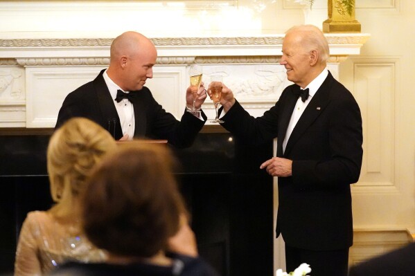 Utah Gov. Spencer Cox, left, and President Joe Biden toast before Biden speaks to members of the National Governors Association during an event in the State Dining Room of the White House in Washington, Saturday, Feb. 24, 2024. (AP Photo/Stephanie Scarbrough)