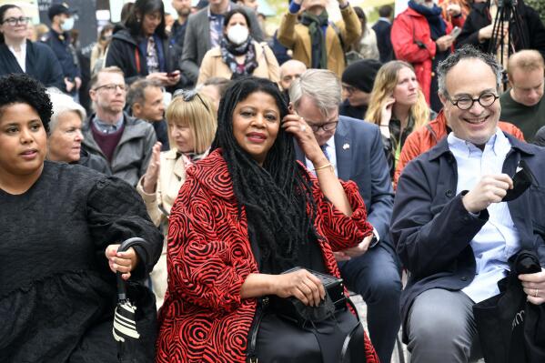 American sculptor Simone Leigh smiles during the unveiling of the United States' pavilion at the 59th Biennale of Arts exhibition in Venice, Italy, Thursday, April 21, 2022. The first Black woman to headline the U.S. Pavilion, Leigh has posted the monumental 24-foot sculpture called "Satellite" outside the neo-Palladian brick structure, which is hidden beneath a thatched raffia roof and wooden columns. (AP Photo/Luigi Costantini)