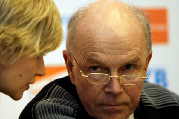 FILE - Anders Besseberg, president of International Biathlon Union, right, listens to IBU Secretary General Nicole Resch before a press conference of the IBU Biathlon World Championships in Pyeongchang, east of Seoul, South Korea, on Feb. 13, 2009. The long-time former biathlon leader accused of protecting Russia from doping cases was Friday April 12, 2024 found guilty of corruption and sentenced to three years and one month. Besseberg who had denied charges relating, was convicted of accepting bribes, a liaison with a prostitute in Moscow, and favoring Russia in doping cases during more than 20 years as president of the International Biathlon Union. (AP Photo/Lee Jin-man, File)