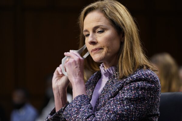 Supreme Court nominee Amy Coney Barrett arrives for her confirmation hearing before the Senate Judiciary Committee, Wednesday, Oct. 14, 2020, on Capitol Hill in Washington. (AP Photo/Susan Walsh, Pool)