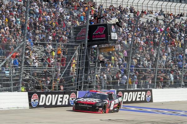 Josh Berry (8) takes the checkered flag to win the NASCAR Xfinity Series auto race at Dover Motor Speedway, Saturday, April 30, 2022, in Dover, Del. (AP Photo/Jason Minto)