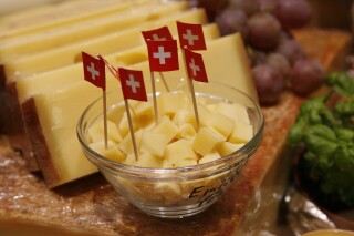FILE - Cheese from Switzerland is presented at the fair eat'n Style in Cologne, Germany, on Friday, Nov. 14, 2008. The head of the Switzerland's dairy association SMP says the country will import more cheese than it exports this year for the first time. (AP Photo/Hermann J. Knippertz, File)