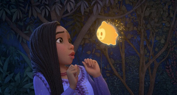 This image released by Disney shows Asha, voiced by Ariana DeBose, in a scene from the animated film "Wish." (Disney via AP)