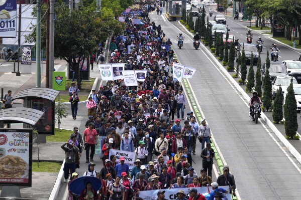 Indigenous people march for the resignation of the Attorney General Consuelo Porras in Guatemala City, Monday, Sept. 18, 2023. President-elect Bernardo Arévalo has called people to protest efforts to derail his presidency before he can take office and for the attorney general's resignation due to its office's investigations related to the registration of Arévalo’s Seed Movement party, and alleged fraud in the election. (AP Photo/Moises Castillo)