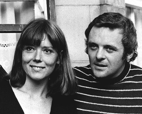 FILE - In this Sept. 20, 1972 file photo, British actress Diana Rigg and actor Anthony Hopkins attend the opening night of Macbeth at the National Theatre, London. Rigg plays Lady Macbeth opposite Hopkins' Macbeth in the Shakespearean tragedy. Actress Diana Rigg, who became a 1960s style icon as secret agent Emma Peel in TV series “The Avengers,” has died at age 82. Rigg’s agent Simon Beresford says she died Thursday Sept. 10, 2020 at home with her family. (AP Photo/Bob Dear, File)