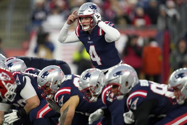 New England Patriots quarterback Bailey Zappe (4) calls a play from the line of scrimmage during the second half of an NFL football game against the Kansas City Chiefs, Sunday, Dec. 17, 2023, in Foxborough, Mass. (AP Photo/Charles Krupa)