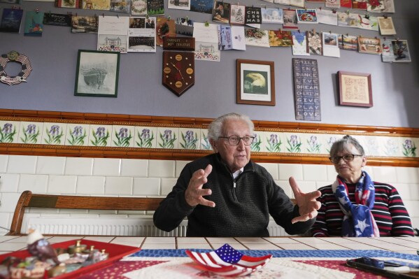 Directors of the WWII Remember Museum 1939-1945, Marcel Schmetz, left, and his wife Mathilde Schmetz speak during an interview at their museum in Thimister-Clermont, Belgium, April 22, 2025. (AP Photo/Virginia Mayo)