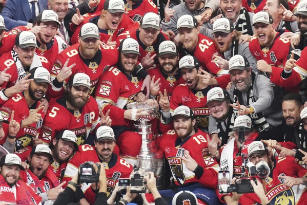 The Florida Panthers celebrate with the Stanley Cup after defeating the Edmonton Oilers in Game 6 of the NHL hockey Stanley Cup Final in Sunrise, Fla., Tuesday, June 17, 2025. (Nathan Denette/The Canadian Press via AP)