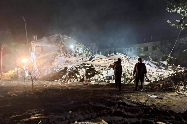In this photo provided by Kharkiv regional Governor Oleh Sunyiehubov, firefighters examine the site of Russia's missile attack that hit an apartment building in Kharkiv Region, Ukraine, Thursday, Feb.15, 2024. (Kharkiv Regional Governor Oleh Sunyiehubov Office/ via 番茄直播)