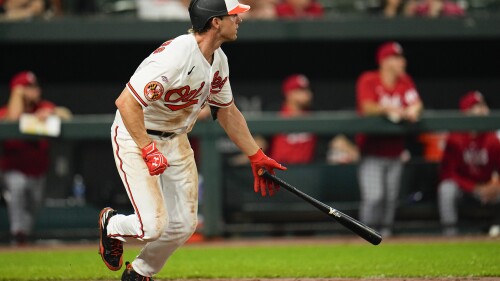 Baltimore Orioles' Jordan Westburg watches his ball after connecting for his first major league hit during the fifth inning of a baseball game against the Cincinnati Reds, Monday, June 26, 2023, in Baltimore. (AP Photo/Julio Cortez)