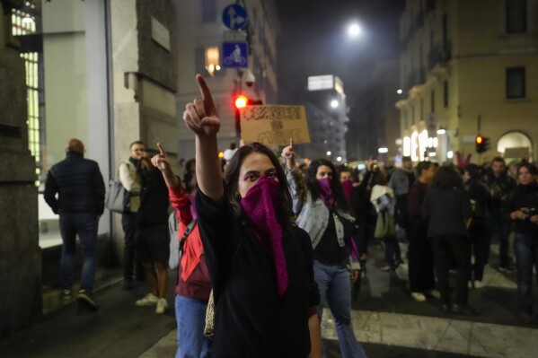 FILE - People stage a protest on 'International Safe Abortion Day' to ask for more guarantees on the enforcement of the abortion law that they claim is seriously endangered by the high rate of doctors' conscientious objection in the country, in Milan, on Sept. 28, 2022. Italy resisted Vatican pressure and guaranteed access to abortion starting in 1978, allowing women to terminate pregnancies upon request in the first 12 weeks of pregnancy, or later if her health or life is endangered. (AP Photo/Luca Bruno, File)