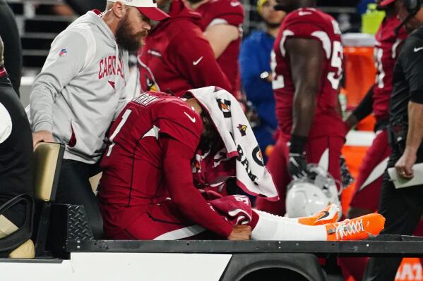 Arizona Cardinals quarterback Kyler Murray (1) is brought off the field after an injury during the first half of an NFL football game against the New England Patriots, Monday, Dec. 12, 2022, in Glendale, Ariz. (AP Photo/Darryl Webb)
