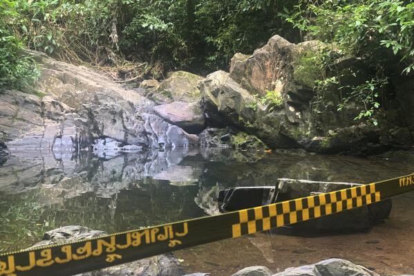 Police tape cordons off the area where a woman was found dead a day earlier at a secluded spot on the southern island of Phuket, Thailand, on Friday, Aug. 6, 2021. Thai authorities have ordered heightened security measures on the resort island of Phuket after the discovery of the body of a 57-year-old Swiss tourist amid signs of foul play, officials said Friday. (AP Photo)