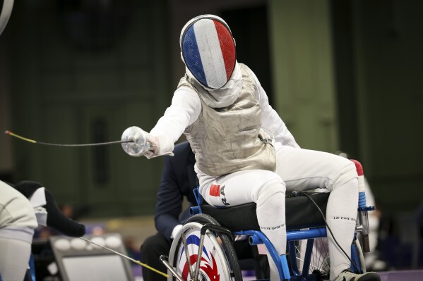 France's Brianna Vide competes against China's Chui Yee Yu during the women's foil wheelchair fencing Category A Repechage Round 4 at the 2024 Paralympics, Wednesday, Sept. 4, 2024, in Paris, France. (AP Photo/Thomas Padilla)