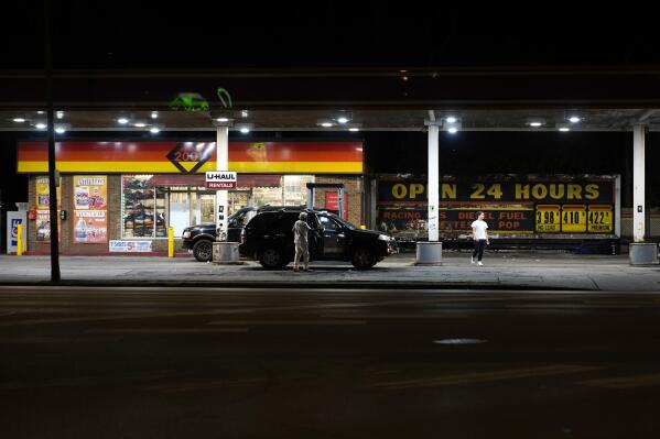 Drivers stop at a gas station on Chicago’s South Side on Tuesday, Aug. 17, 2021, where Michael Williams tried to get cigarettes late on a Sunday evening in May 2020, the night Safarian Herring was shot. (AP Photo/Charles Rex Arbogast)