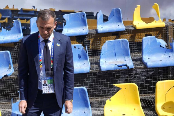 Andriy Shevchenko, Ukrainian football legend and UAF President, presents an installation ahead of the Group E match between Romania and Ukraine at the Euro 2024 soccer tournament in Munich, Germany, Monday, June 17, 2024. A poignant installation has been unveiled ahead of Ukraine’s first match at the European Championship. A destroyed stand from Kharkiv’s Sonyachny stadium that was built for Euro 2012 has been displayed in a square in Munich ahead of the team’s opener against Romania. (AP Photo/Ariel Schalit)