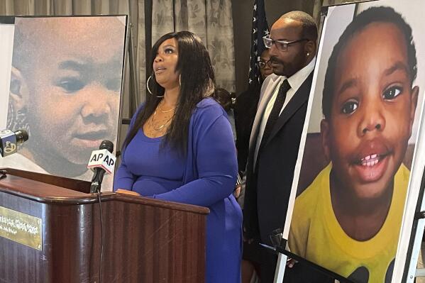 Ryan Dean, the biological mother of two young brothers who were killed while in a foster home, speaks during a news conference in San Francisco, Tuesday, June 21, 2022. Dean has filed a lawsuit against the California Department of Social Service and Kern County Human Services alleging the toddlers were unlawfully taken from her and placed with foster parents who are now charged with killing them. Looking on is her attorney Waukeen Q. McCoy. (AP Photo/Haven Daley)