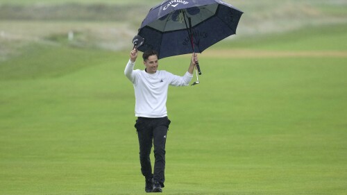 England's Matthew Jordan acknowledges the crowd as he walks onto the 18th green during the final day of the British Open Golf Championships at the Royal Liverpool Golf Club in Hoylake, England, Sunday, July 23, 2023. (AP Photo/Kin Cheung)