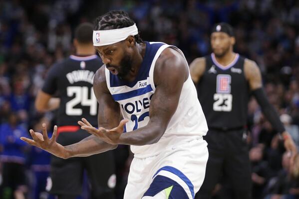Minnesota Timberwolves guard Patrick Beverley (22) looks at his hands after a foul call against the Los Angeles Clippers during the first quarter during an NBA basketball game Tuesday, April 12, 2022, in Minneapolis. (AP Photo/Andy Clayton-King)