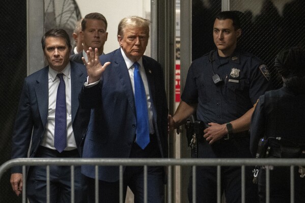 Former President Donald Trump returns from a break at Manhattan Criminal Court in New York, Thursday, April 18, 2024. (Jeenah Moon/Pool Photo via AP)
