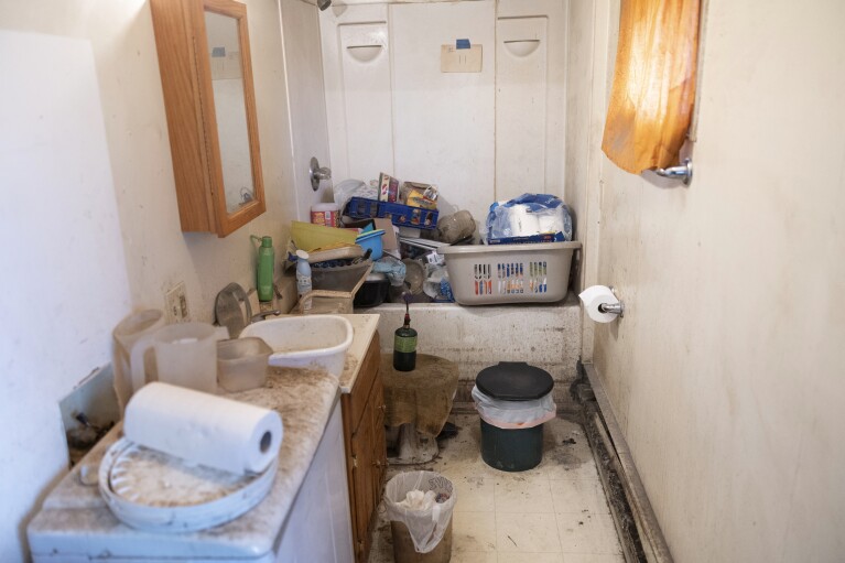A honey bucket toilet sits inside Vera Manutoli's bathroom, Sunday, Aug. 20, 2023, in Akiachak, Alaska. (AP Photo/Tom Brenner)