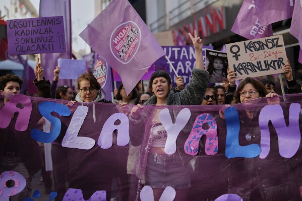 Women chant slogans during a protest marking International Women's Day in Istanbul, Turkey, Saturday, March 8, 2025. (AP Photo/Emrah Gurel)