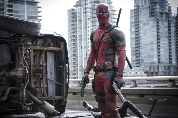 
              This image released by Twentieth Century Fox shows Ryan Reynolds in a scene from the film, "Deadpool." When Walt Disney Co.’s $71.3 billion acquisition of Fox is completed at 12:02 a.m. Wednesday, Disney will add the R-rated superhero Deadpool, the X-Men and the Fantastic Four to its bench of Marvel characters. (Joe Lederer/Twentieth Century Fox Film Corp. via AP)
            