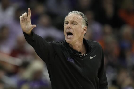 TCU head coach Jamie Dixon motions to his players during the first half of an NCAA college basketball game against Kansas State in the second round of the Big 12 Conference tournament Thursday, March 9, 2023, in Kansas City, Mo. (AP Photo/Charlie Riedel)