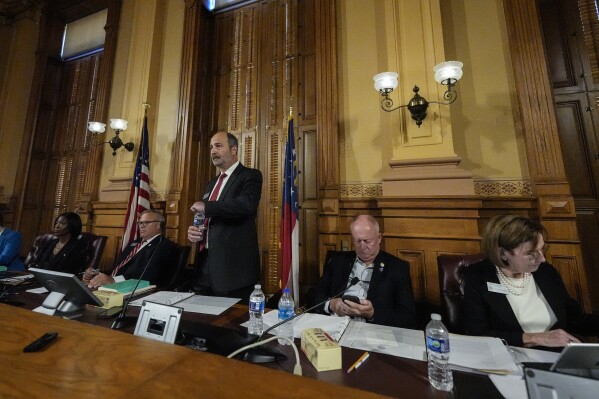 Georgia's State Election Board members discuss proposals for election rule changes at the state capitol, Friday, Sept. 20, 2024, in Atlanta. (AP Photo/Mike Stewart, File)