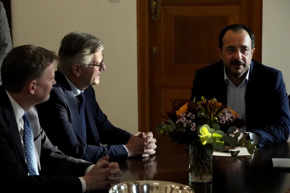 UN Under-Secretary-General for Peacekeeping Operations Jean-Pierre Lacroix, center, and U.N. Secretary General's Special Representative in Cyprus Colin Stewart, left, talk with Cyprus' with Cyprus' President Nikos Christodoulides during their meeting in divided capital Nicosia, Cyprus, on Wednesday, Nov. 1, 2023. Lacroix is in Cyprus for three-day visit. (AP Photo/Petros Karadjias)