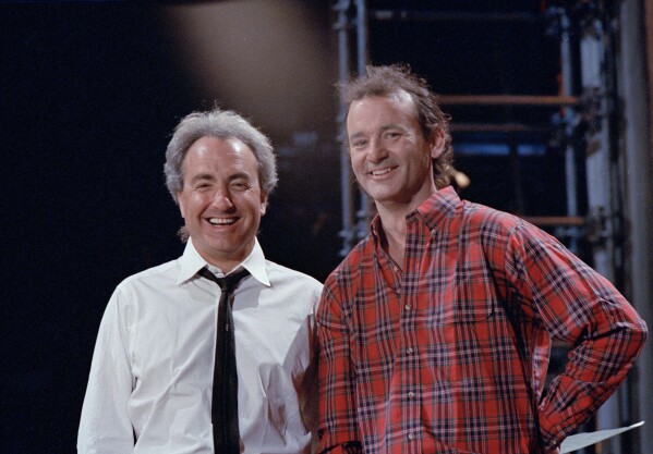 "Saturday Night Live" host Bill Murray, a former cast member, is pictured with producer Lorne Michaels, left, during rehearsals on March 19, 1987, in New York. (AP Photo/G. Paul Burnett, File)