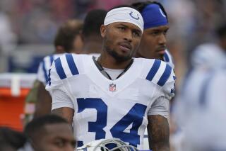 FILE - Indianapolis Colts cornerback Isaiah Rodgers Sr. (34) stands on the sideline during an NFL football game against the New England Patriots on Nov. 6, 2022, in Foxborough, Mass. Rodgers did not practice with his teammates Wednesday, June 7, 2023, two days after the team said it was aware of an NFL investigation into gambling allegations about one of its players. (AP Photo/Charles Krupa, File)