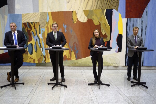 From left: Terje Halleland (Progress Party), Aleksander Oren Heen (Center Party), Marianne Sivertsen Naess (Labour Party) and Bard Ludvig Thorheim (Conservative Party) give a joint press conference on the deal on extraction of seabed minerals made between the governing party and two large opposition parties, in Oslo, Norway, Tuesday Dec. 5, 2023. (Terje Pedersen/NTB Scanpix via AP)