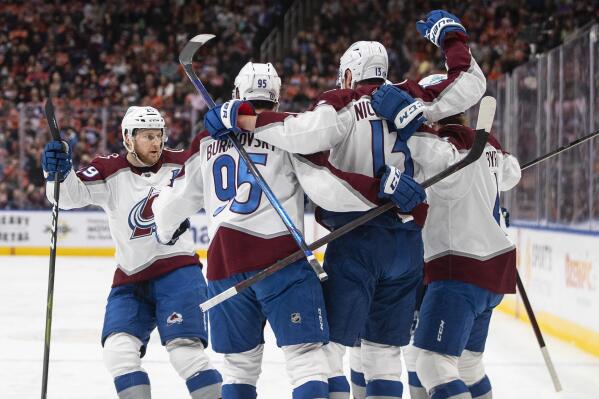 Colorado Avalanche celebrate a goal against the Edmonton Oilers during first-period NHL hockey game action in Edmonton, Alberta, Friday, April 22, 2022. (Jason Franson/The Canadian Press via AP)