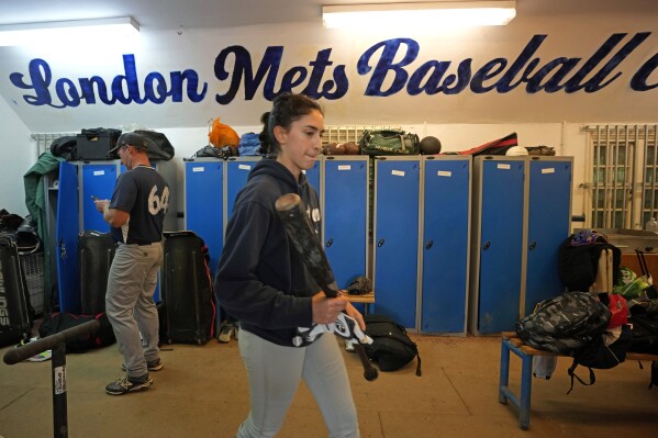 Players of the UK baseball team London Mets arrive clubhouse for a training session at the Finsbury Park in London, Thursday, May 16, 2024. Baseball at the highest club level in Britain is competitive. Teams are mélange of locals and expats some with college and minor league experience. (AP Photo/Kin Cheung)