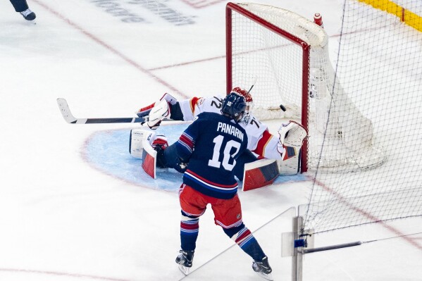 New York Rangers left wing Artemi Panarin (10) scores against Florida Panthers' Sergei Bobrovsky (72) during the penalty shootout of an NHL hockey game on Saturday, March 23, 2024 in New York. (AP Photo/Peter K. Afriyie)