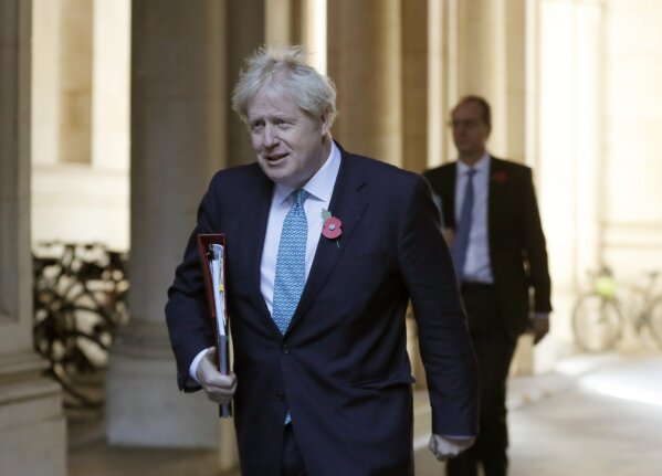 Britain's Prime Minister Boris Johnson walks back towards10 Downing Street following a cabinet meeting in London, Tuesday, Nov. 3, 2020. The Cabinet meeting is held in the Foreign Office to allow for social distancing due to the ongoing Coronavirus pandemic, rather than the normal 10 Downing Street. (AP Photo/Frank Augstein)