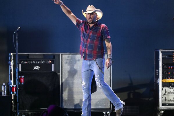 
              FILE - In this Sept. 21, 2018 file photo, Jason Aldean performs at the 2018 iHeartRadio Music Festival in Las Vegas. Reigning entertainer of the year Aldean will receive the artist o...