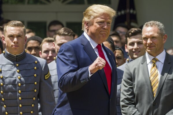 
              President Donald Trump pumps his fist as he departs after the presentation of the Commander-in-Chief's Trophy to the U.S. Military Academy at West Point football team, in the Rose Garden of the White House, Monday, May 6, 2019, in Washington. (AP Photo/Alex Brandon)
            